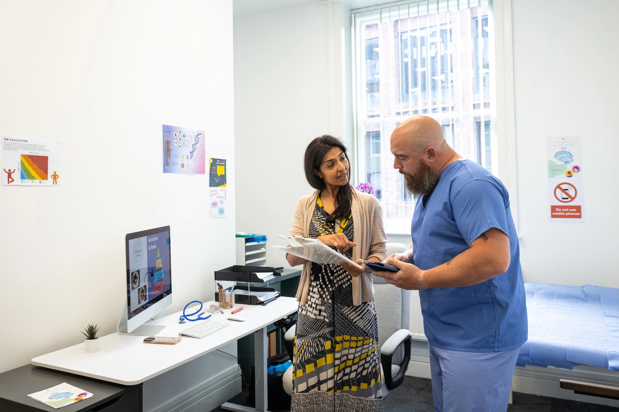 Professionals reviewing care notes together