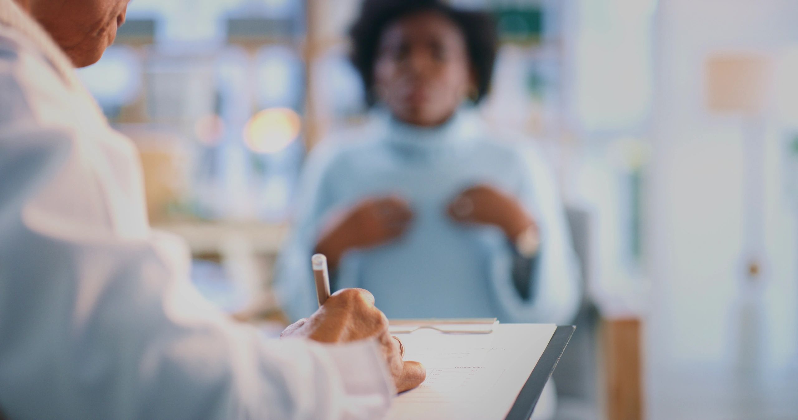 Therapist taking notes during a counseling appointment